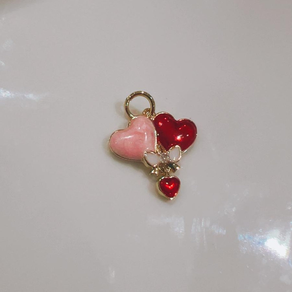 Balloon hearts charm with a bunch of heart-shaped balloons on a white background