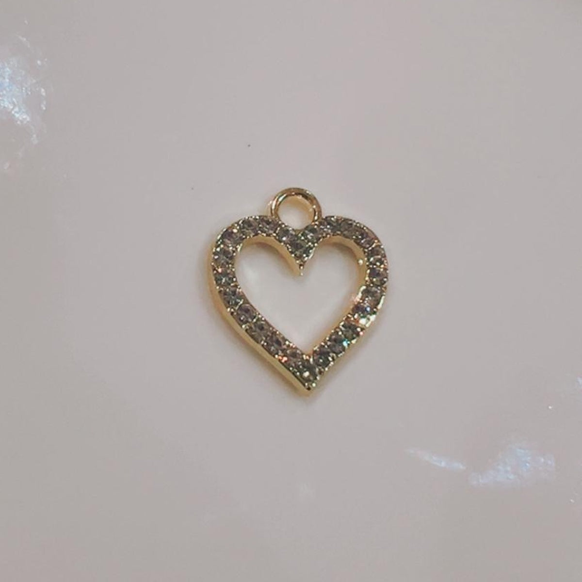 Open crystal heart charm with a hollow centre on a white background